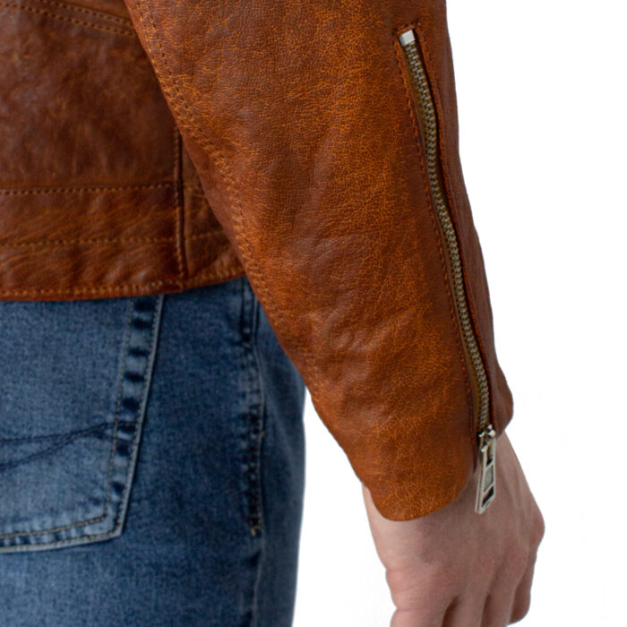 Oxus zip detail on the sleeve of the brown jacket