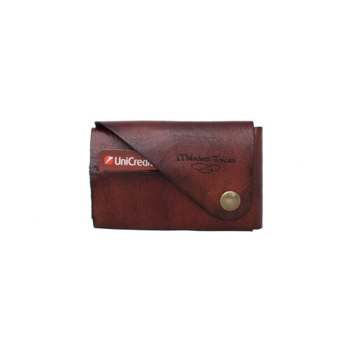 Complete wallet without seams in front of brown sandal-dark brown